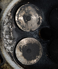 Valve in a deposit on the removed cover of the engine valve box.