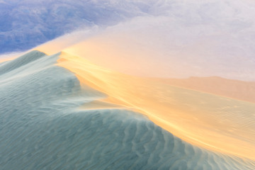 Wind blowing sand at Mesquite Sand Dunes. Death Valley. California.