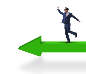 Fototapeta premium Businessman walking on arrow isolated on white background