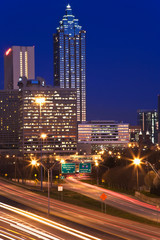 Fototapeta na wymiar USA, Georgia, Atlanta. Atlanta skyline at dusk with Freedom Parkway in the foreground. 