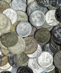 Russian banknotes and coins. A handful of coins on new Russian banknotes in denominations of 2000...