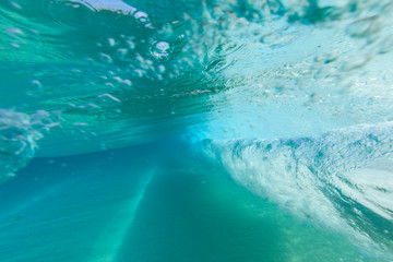Fototapeta na wymiar Fisheye view of wave breaks at Kua Beach, North of Kona, Big Island, Hawaii