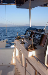 Fototapeta premium USA, Hawaii, Kauai, sport fishing boat heading out to sea. 