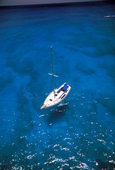 USA, Hawaii. Sailboat in crystal blue water