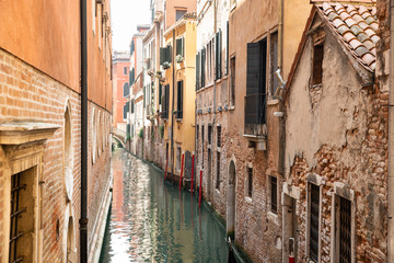 Obraz na płótnie Canvas Narrow Canal In Venice, Italy
