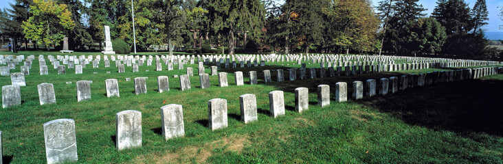 USA, Maryland, Antietam. Weathered headstones stand in neat rows on the greens of Antietam National Battlefield Cemetery, in Maryland.