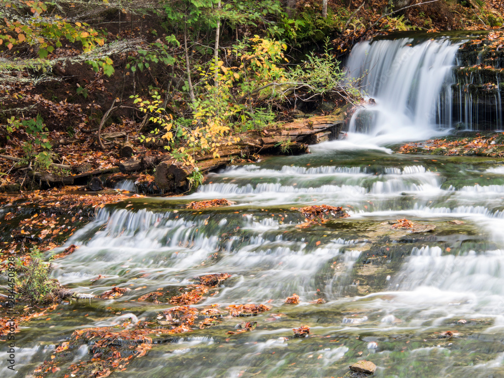 Wall mural USA, Michigan, Upper Peninsula. Lower Au train Falls, autumn waterfall scene in Upper Michigan.