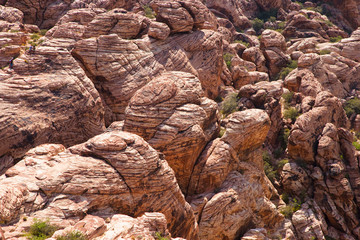 Las Vegas, NV, USA - High angle view of a desert wall rock face on the side of a hill.