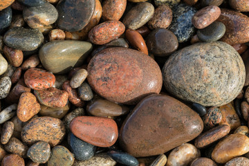 Smooth granite pebbles on beach of Lake Superior, Whitefish Point, Upper Peninsula, Michigan