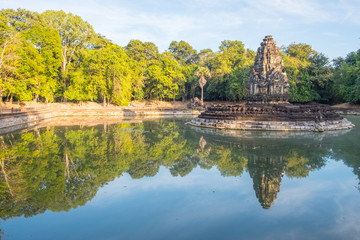 Fototapeta na wymiar Beautiful reflection of Neak Pean temple with holy pond in ancient Khmer civilization in Siem Reap, Cambodia.
