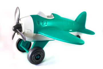 toy airplane with a propeller without a pilot on a white background, tiffany color