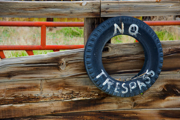 No Trespass'. A ranch sign warning visitors to keep out.