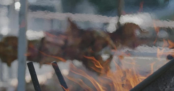 Lamb and pig roast grill barbecue with focus on heat and fire
