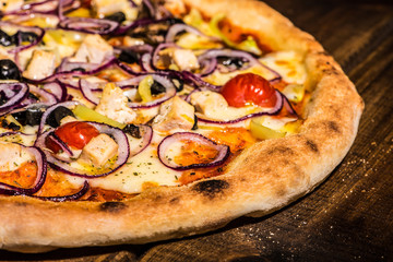 Fresh pizza made in a small bakery