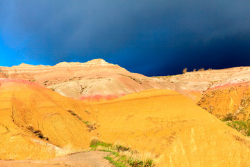 Sunlight illuminating the colorful clays of an ancient seabed in Badlands National Park, SD