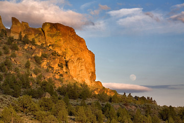 USA, Oregon, Smith Rocks SP. A full moon rises above the east side of Smith Rocks State Park in central Oregon.