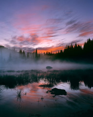USA, Oregon, Sisters Mirror Lake. Colorful clouds fill the sunrise sky at Sisters Mirror Lake in Cascades Range, Oregon.