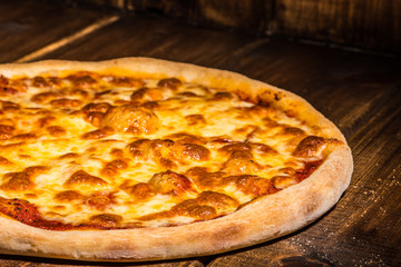 Fresh pizza made in a small bakery