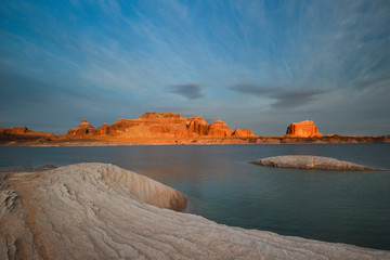USA, Utah. Padre Bay sunrise with clouds and rock strata formations and Dominguez Butte in background