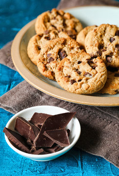 Traditional chocolate chip cookies on rustic wooden blue table