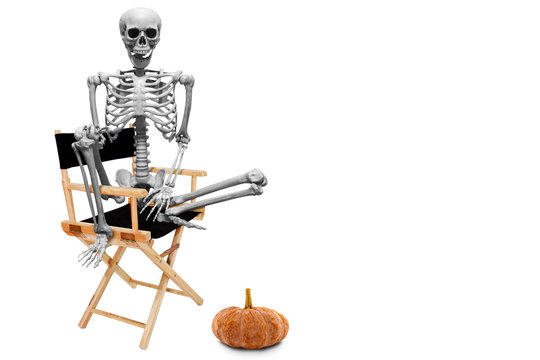 Fake human skeleton sitting on director chair isolated on white background.halloween concept.