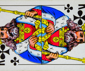 Card playing king of clubs, suit of clubs.