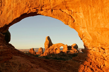USA, Utah, Arches National Park. Turret arch seen through the North Window at sunrise. Credit as: Cathy & Gordon Illg / Jaynes Gallery / DanitaDelimont.com © Jaynes Gallery/Danita Delimont