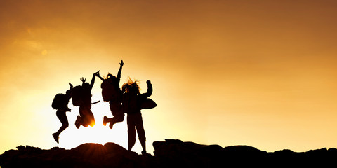 Obraz na płótnie Canvas Group of asian female jumping on top mountain..