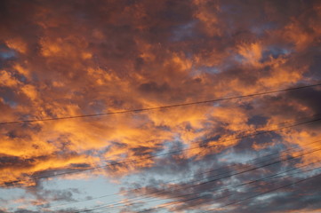  clouds during sunset.  clouds before sunset. sky at sunset. sky in the city. orange sky. summer sky