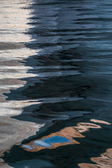 USA, Utah, Glen Canyon National Recreation Area. Abstract design of canyon wall and sky reflections.