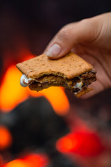 Handing holding a freshly made s'more