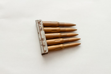 weapon  cartridge for a firearm machine gun on white background