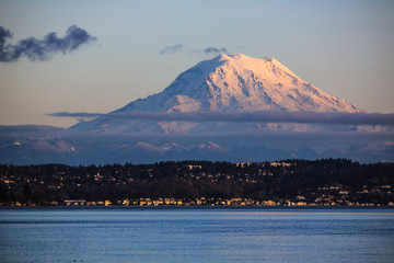 Fox Island, Washington State. Snowy Mount Rainier towers over land and sea