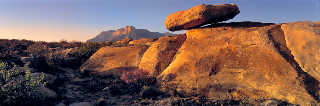 USA, Texas, Guadelupe Mountains NP. Sunset warms a balanced rock near Guadelupe Mountains National Park in west Texas.