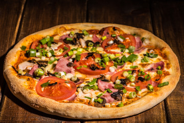 Fresh pizza made in a small bakery