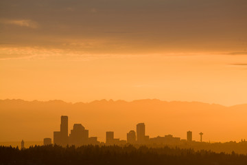 USA, Washington State, Seattle skyline and Olympic Mountains viewed from Bellevue at sunset.