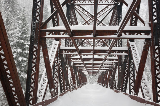 USA, Washington, Leavenworth. Snow-covered Pipeline Bridge superstructure. © Jaynes Gallery/Danita Delimont