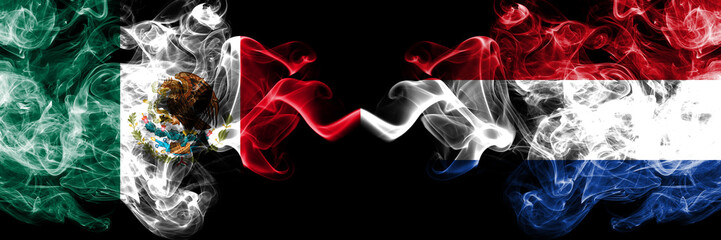 Mexico vs Netherlands, Dutch smoky mystic flags placed side by side. Thick colored silky abstract smokes banner of Mexican and Netherlands, Dutch