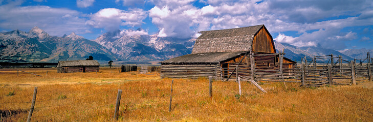 USA, Wyoming, Grand Teton NP. An old wooden barn is part of a homestead in Grand Teton National...