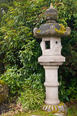 USA, WA, Seattle. Kubota Gardens early spring. 20 acres of plantings were designed by the Fujitaro Kubota family in the early 20th century. Stone lantern with moss growing.