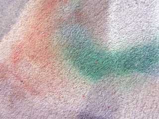 A fragment of colored graffiti. Close-up. Abstract colorful grunge background for your design. Modern street art. Graffiti detail.