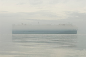 USA, WA, San Juan Islands Ghost ship emerges eerily from dense fog bank