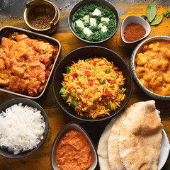 Assorted indian food on black background..