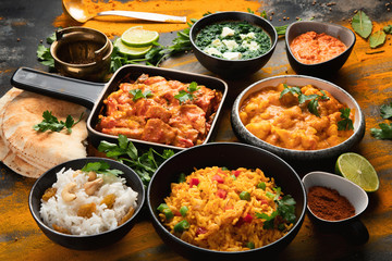 Assorted indian food on black background..