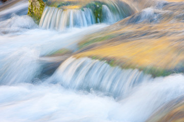Wyoming, Sublette County, Close-up of Pine Creek flowing over rocks with slow shutter speed creating blurred motion.