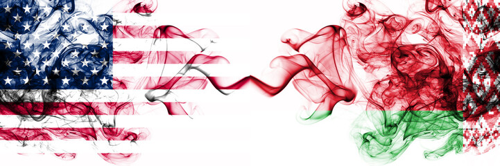 United States of America vs Belarus, Belarusian smoky mystic flags placed side by side. Thick colored silky abstract smokes banner of America and Belarus, Belarusian