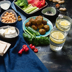 Vegetarian variety dishes on black background.