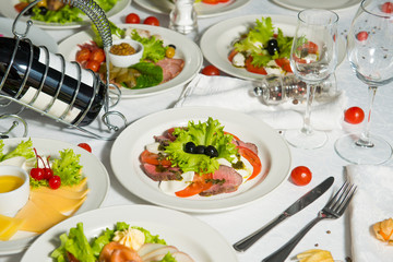 A restaurant dish of chopped smoked meat on a table in a plate. Cold appetizer.