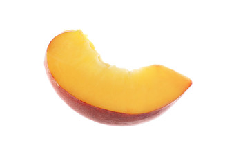 Slice of sweet juicy peach on white background