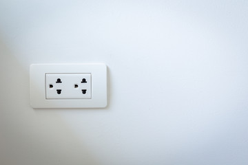 Electrical plugs on the white wall